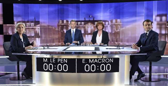 Marine Le Pen et Emmanuel Macron lors du débat de l'entre-deux-tours de la présidentielle (© Eric Feferberg - AFP)