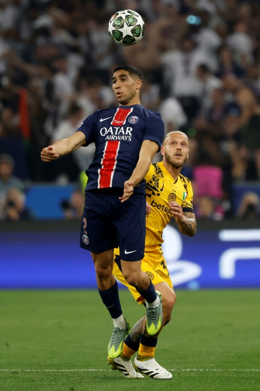 Achraf Hakimi (g) lors de la victoire du PSG en finale de la Ligue des champions, le 31 mai 2025 à Munich