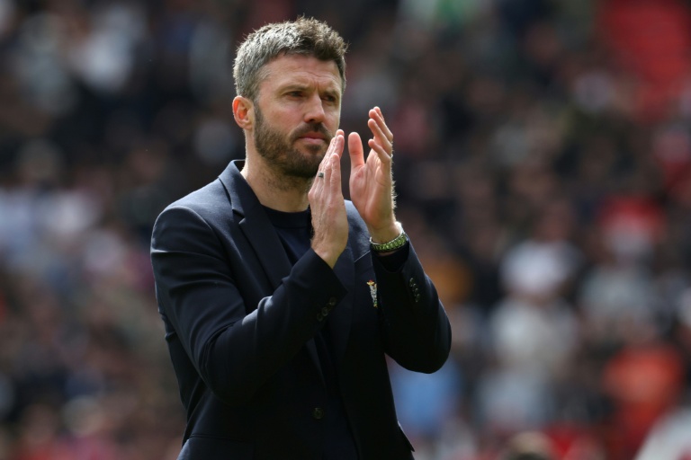L'entraîneur intérimaire de Manchester United Michael Carrick, parti pour rester à la tête des Red Devils, après le succès 3-2 contre NOttingham, le 17 mai 2026 à Old Trafford