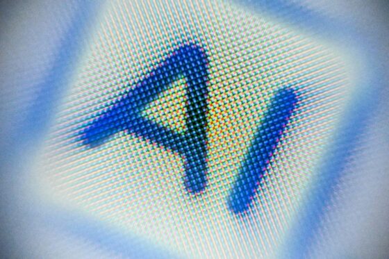 Un écran montrant les lettres 'AI' en pixel sur un fond flou.